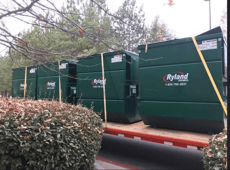 Multiple Ryland Environmental 8-yard commercial dumpsters ready for delivery