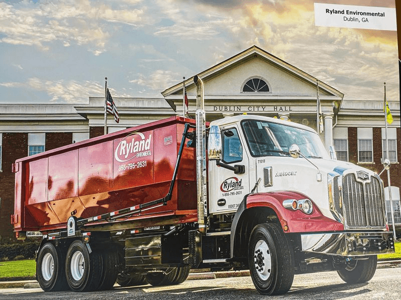 Ryland Environmental roll-off truck delivering container in Dublin, Georgia