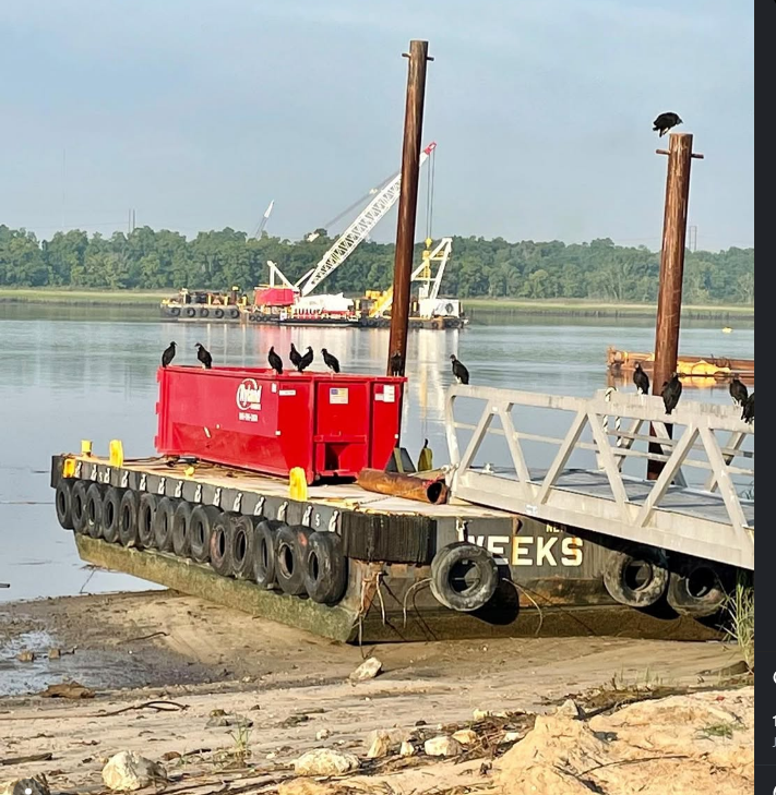 Ryland Environmental roll-off dumpster on a barge for waterfront construction